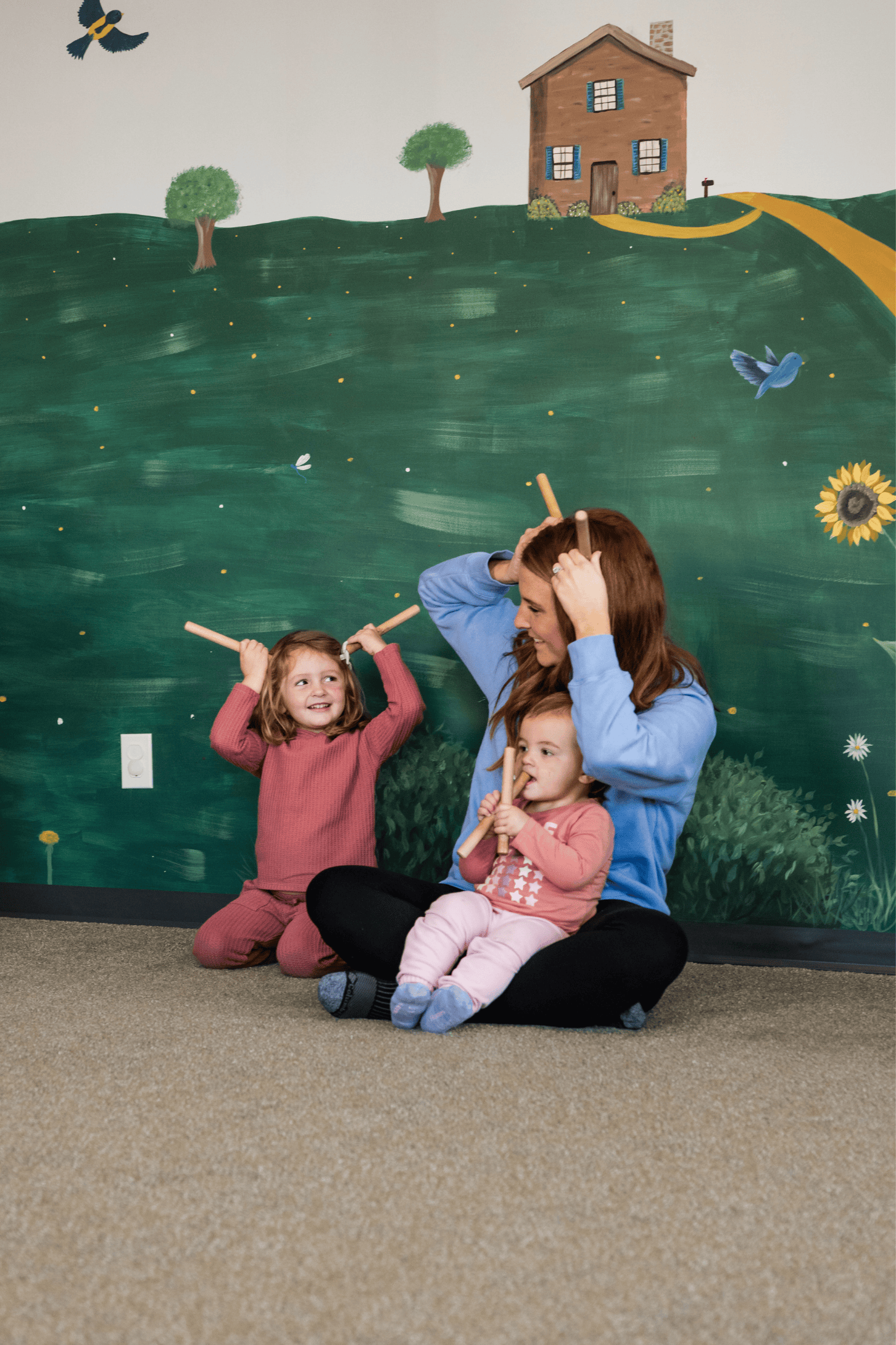 Happy children and parents in Musikgarten class